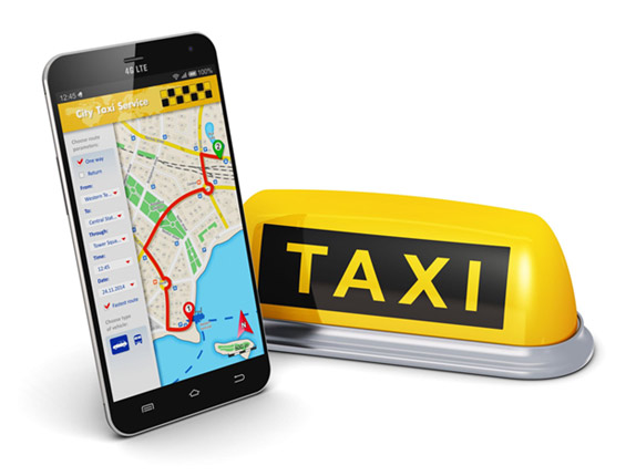 Smartphone displaying a map next to a taxi sign.